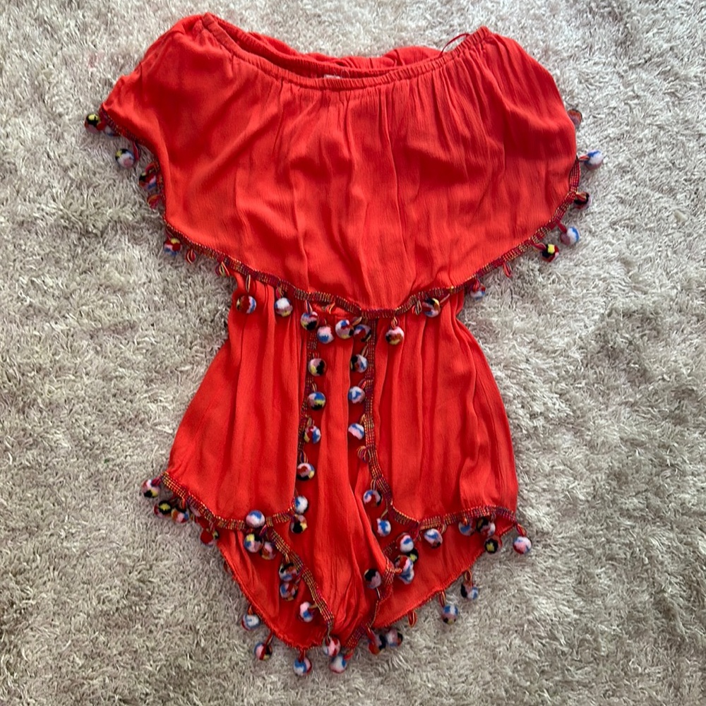 Surf gypsy coral romper with pom-poms